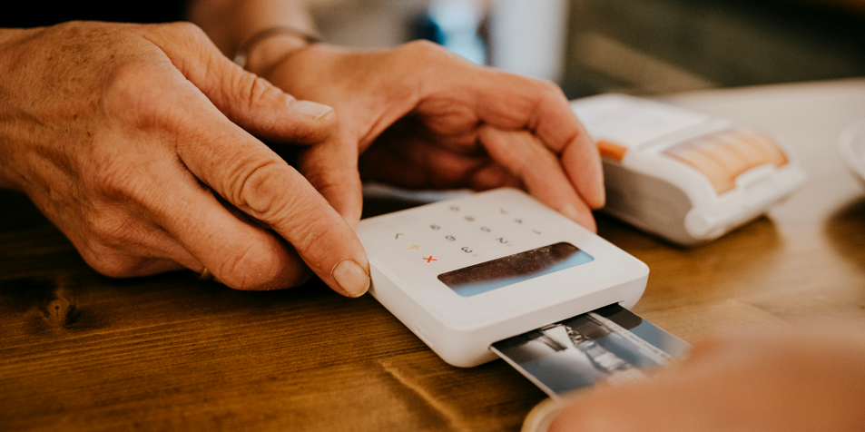 person using a debit machine